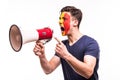 Fan support of Belgium national team with painted face shout and scream on megaphone isolated on white background Royalty Free Stock Photo