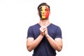 Fan support of Belgium national team pray with painted face isolated on white background Royalty Free Stock Photo