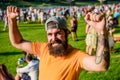 Fan zone. Music festival. Entertainment concept. Visit summer festival. Summer fest. Hipster in cap happy celebrate Royalty Free Stock Photo