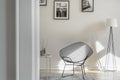 Fancy black metal chair in bright room in tenement house