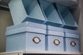 Fancy blue textile gift storage box on a shelf