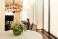 Floral arrangement in round vase on table