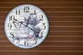 Fancy butterfly and flower clock decorate on wooden wall