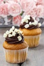 Fancy chocolate cupcakes on wooden table Royalty Free Stock Photo