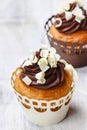 Fancy chocolate cupcakes on wooden table Royalty Free Stock Photo