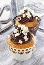 Fancy chocolate cupcakes on wooden table Royalty Free Stock Photo