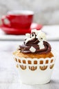 Fancy chocolate cupcakes on wooden table Royalty Free Stock Photo