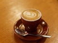 Fancy Coffee Latte Macchiato on wooden table