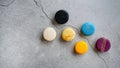 Fancy color macaroons, French snack, pastry recipe, almond flour, colorful macarons minimal composition, trendy on grey background