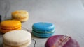 Fancy color macaroons, French snack, pastry recipe, almond flour, colorful macarons minimal composition, trendy on grey background