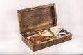 Fancy dish with grilled pork ribs, barbecue sauce, French fries, Coleslaw salad, in a wooden box