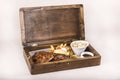 Fancy dish with grilled pork ribs, barbecue sauce, French fries, Coleslaw salad, in a wooden box Royalty Free Stock Photo