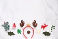Fancy headband with reindeer antler and decorative christmas for party and celebration on white marble background