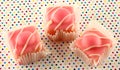 Fancy pink iced fondant cakes. Royalty Free Stock Photo