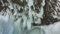 Fancy large icicles-stalactites hang from the stone vault of the grotto.