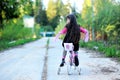 Fancy little girl riding her pink bike Royalty Free Stock Photo