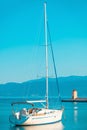 Fancy little yacht moored in the harbor of a small town Postira - Croatia, island Brac Royalty Free Stock Photo