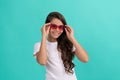 fancy party look. smiling funny kid in red eyeglasses. funky teen girl having fun.