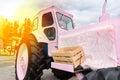 Fancy pink tractor covered with fur blanket