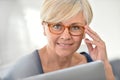 Fancy senior woman wearing eyeglasses Royalty Free Stock Photo