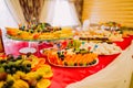 Fancy served fruit buffet on luxurious party table in restaurant