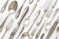 fancy silver cutlery set on white