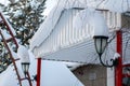 Scene of a snowy winter. Fancy snow caps on street lights