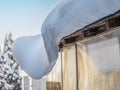 Fancy snow cornice on a shed roof Royalty Free Stock Photo