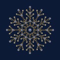 Fancy snowflake made of jewelry gold chains, shiny ball beads, blue gemstones