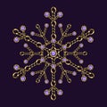 Fancy snowflake made of jewelry gold chains, shiny ball beads, purple gemstones