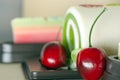 Fancy soap in cake form with cherry on the top Royalty Free Stock Photo