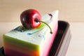 Fancy soap in cake form with cherry on the top Royalty Free Stock Photo