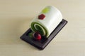 Fancy soap in rolled cake form with cherry Royalty Free Stock Photo