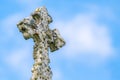 Fancy Stone Cross Covered With Moss