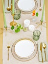 The fancy table layout with golden cutlery and candles for an anniversary or a romantic lunch. Royalty Free Stock Photo