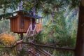 Fancy tree house with a view of a valley