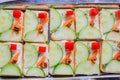 Fancy vegetarian canapes cut in a geometric shapes.