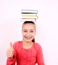 Fanny girl with OK sign and books on head