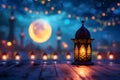 fanous Ramadan lanterns on a table at night with mosque in the background