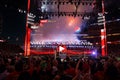 Fans cheer and record action on phones at close of Wrestlemania