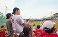 Fans cheer at a Red Sox game