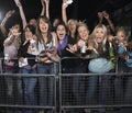 Fans Leaning Over Barrier