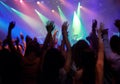 Fans, people or dancing at concert, music festival or night party, neon lights or event energy. Dance, fun and show Royalty Free Stock Photo