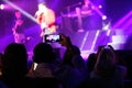 Fans take pictures with their mobile phones during David Bustamante live in mallorca