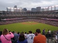 Fans watch baseball game from the Outfield Bleachers Royalty Free Stock Photo