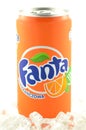 Fanta drink in a can on ice isolated on white background.