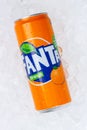 Fanta orange lemonade soft drink in a can on ice cubes portrait format Royalty Free Stock Photo