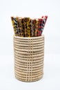 Fantacy pencils in pot on a white background