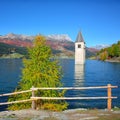 Fantasic autumn view of submerged bell tower in lake Resia