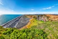 Fantasic view of Kirkjufjara black sand beach from Dyrholaey promontory on Atlantic South Coast